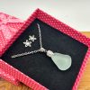 Shop our elegant pink polka dot gift box, featuring a stunning necklace with a frosted glass pendant and matching flower-shaped earrings. This beautiful jewelry set is displayed on luxurious black velvet, making it the perfect present for any special occasion. Ideal for birthdays, anniversaries, or as a thoughtful gift for her.