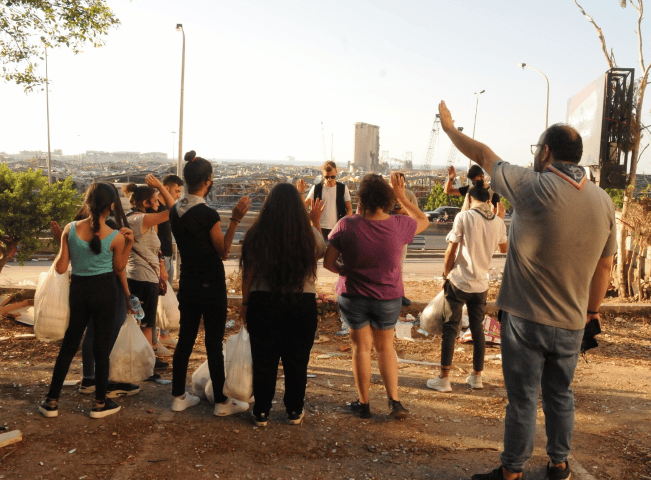 Young People praying in street