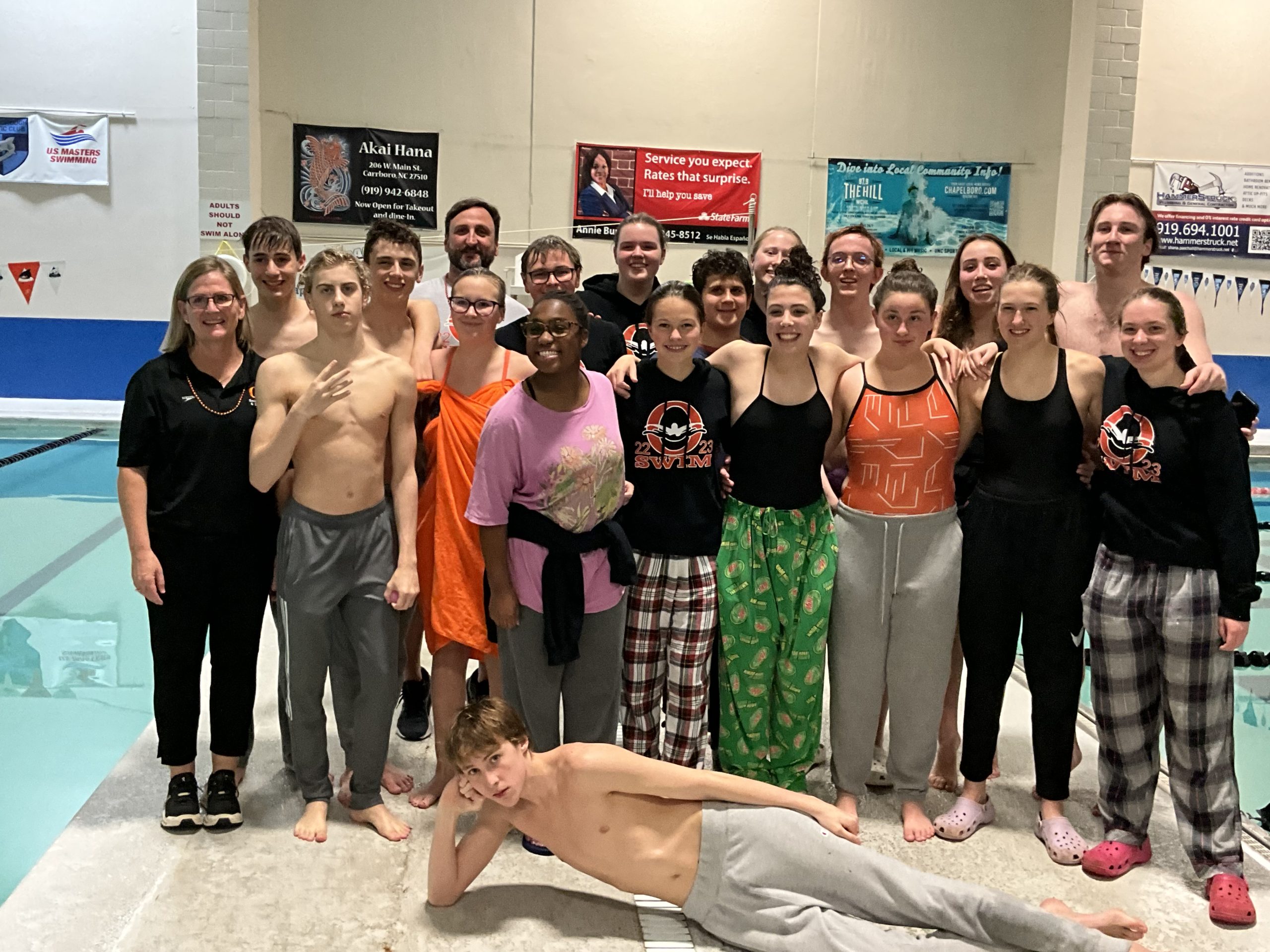 Sikes wins four gold medals, Roman, Phillips three as Orange men's and women's swim teams take