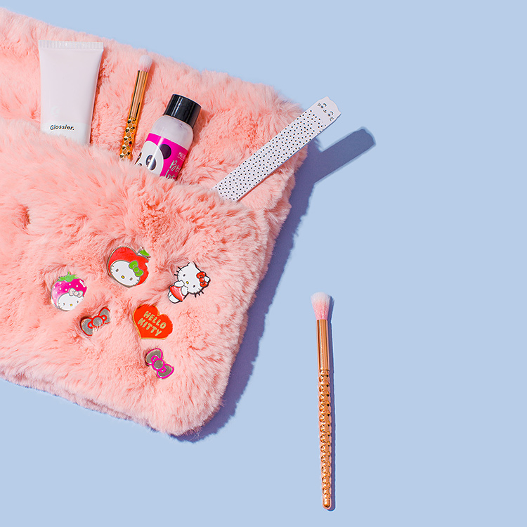 Colourful product photography and styling of Hello Kitty pins by Marianne Taylor.