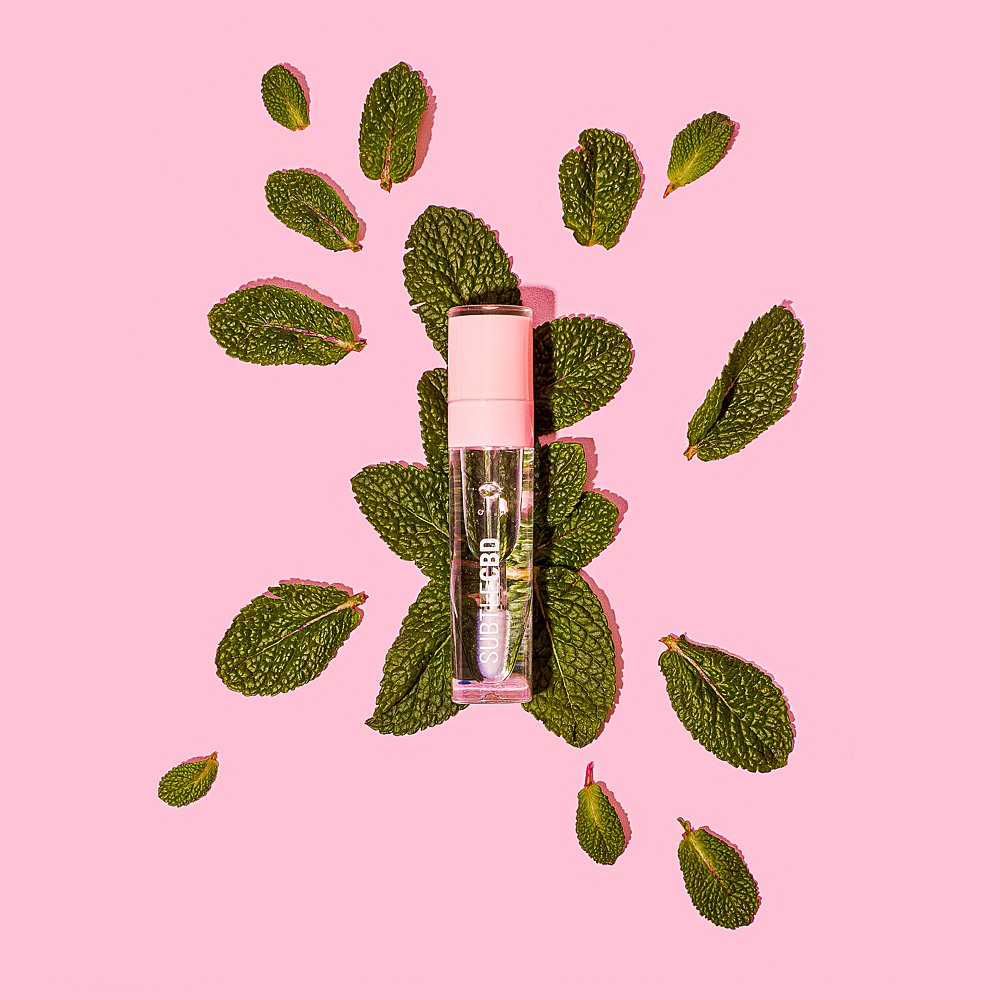 Beauty stills content creation for Subtle CBD lipgloss in pink tones. Styled makeup and cosmetics product stills photography by Marianne Taylor.