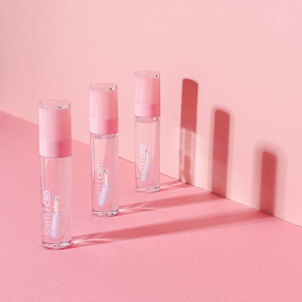 Beauty stills content creation for Subtle CBD lipgloss in pink tones. Styled makeup and cosmetics product stills photography by Marianne Taylor.