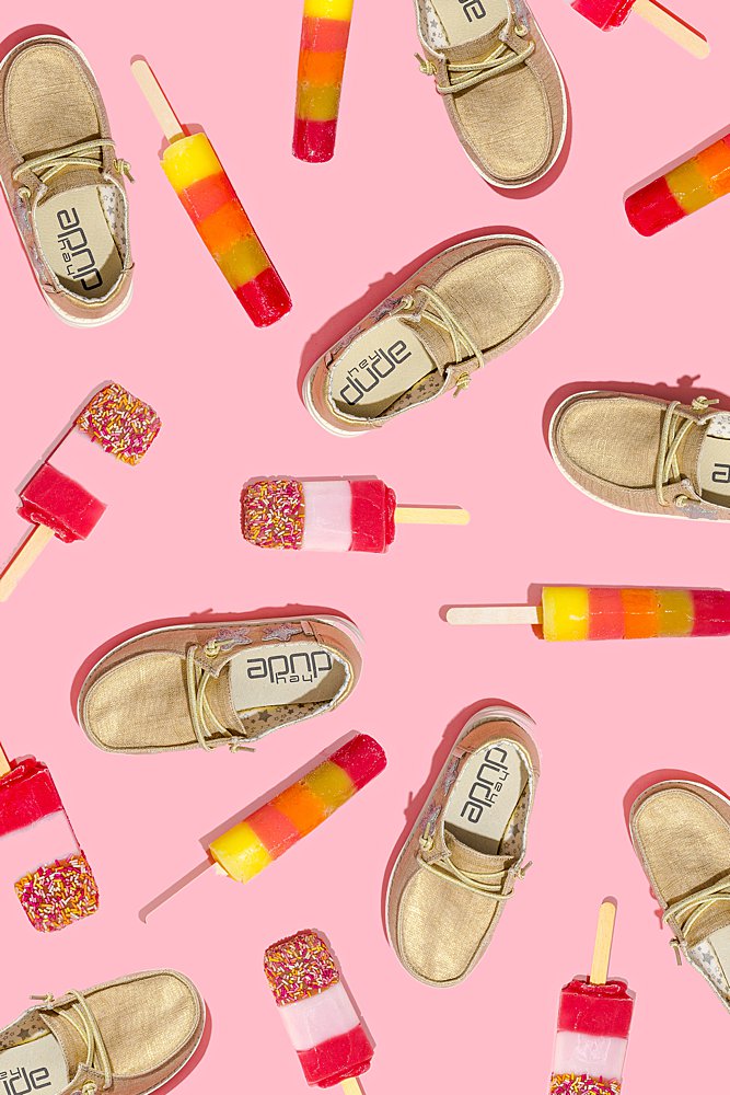 Fun colourful product photography for Hey Dude Shoes. Styled product stills photography by Marianne Taylor.