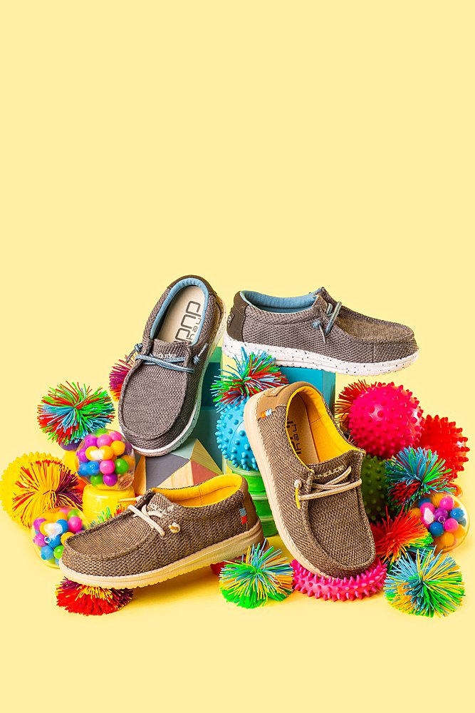 Fun colourful product photography for Hey Dude Shoes. Styled product stills photography by Marianne Taylor.