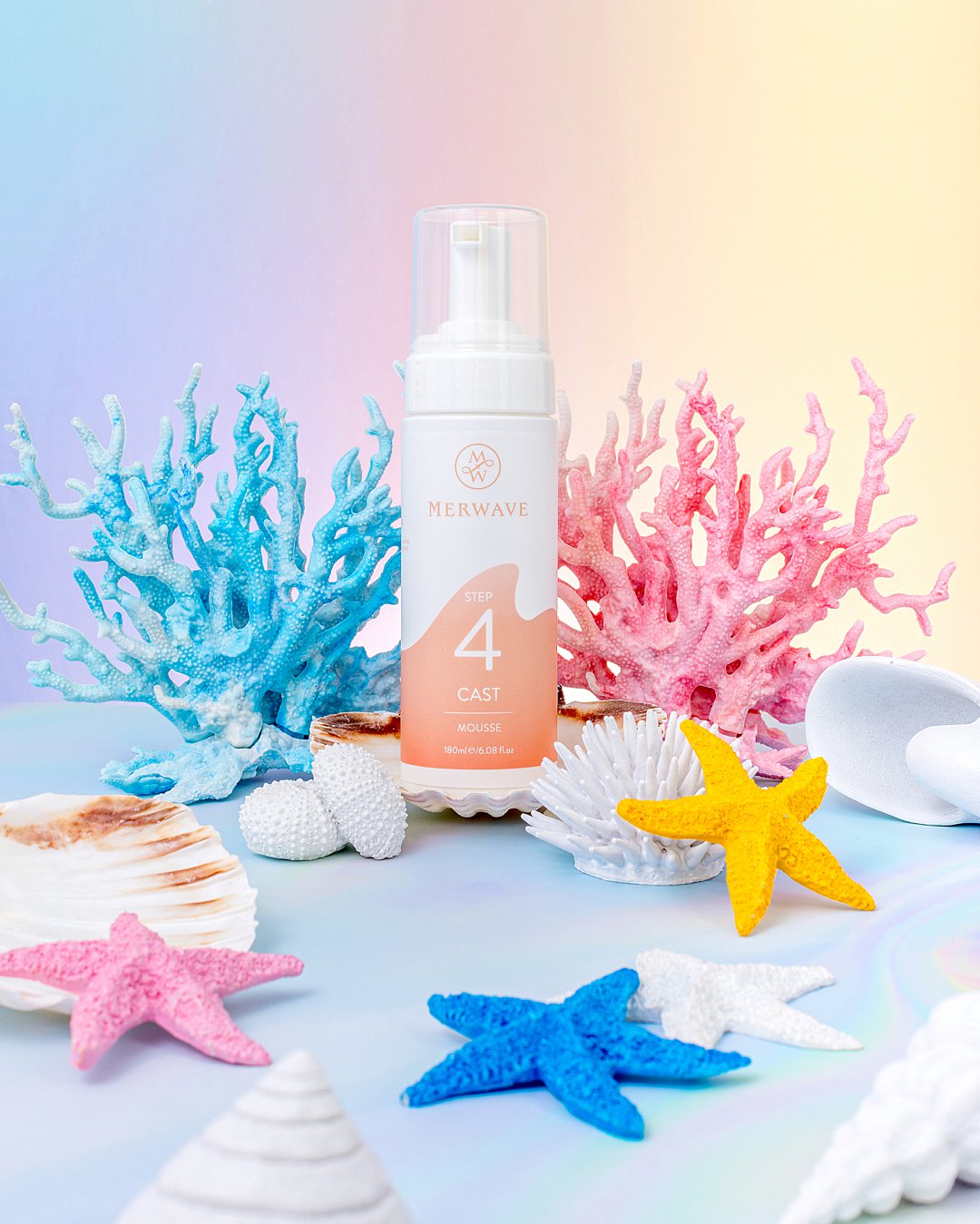 Colourful undersea product photography for Merwave wavy hair haircare products. Mermaid styling and still life photography by HIYA MARIANNE photo production studio.