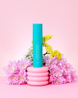 Colourful product photography of Neumi hair product. Art Direction & Photography by HIYA MARIANNE Photo Production Studio.