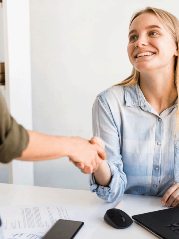 high-angle-womens-shaking-hands high-angle-womens-shaking-hands