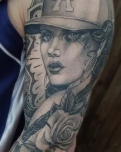 single needle black & grey LA girl head tattoo