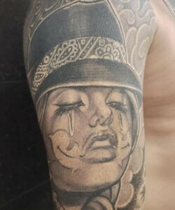 black & grey clown girl tattoo