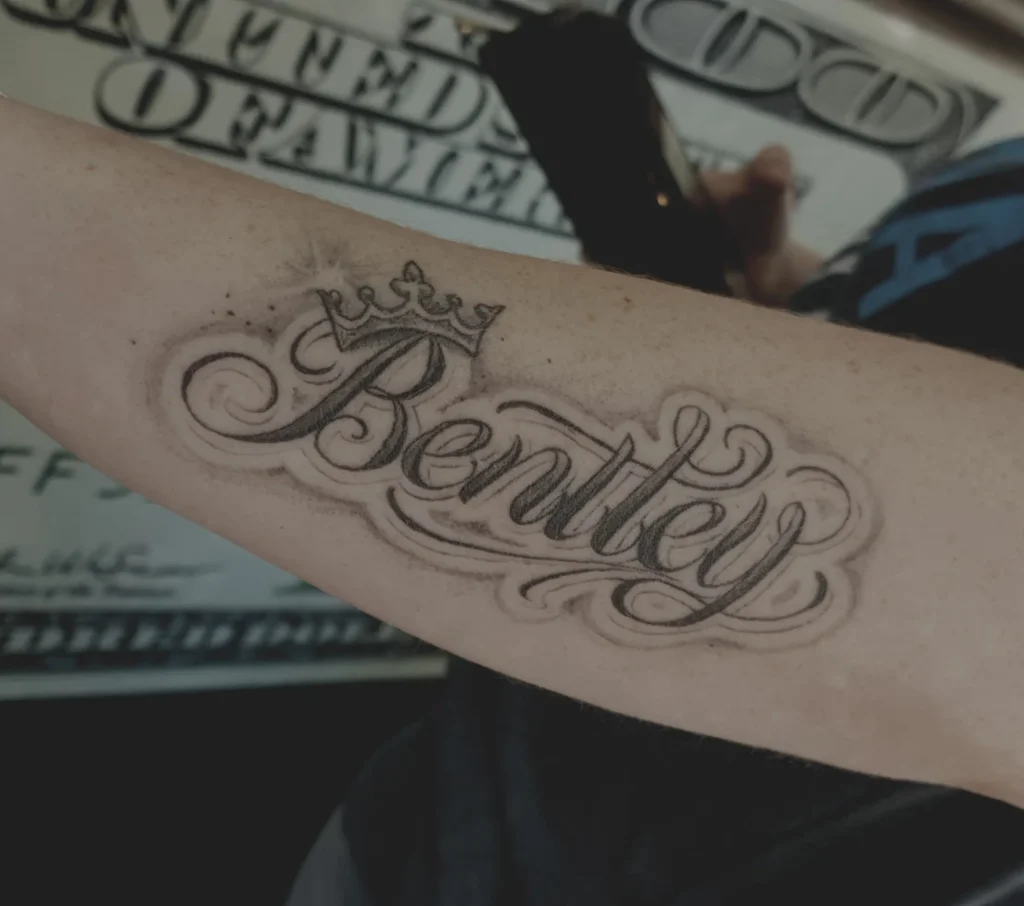 script tattoo name on arm