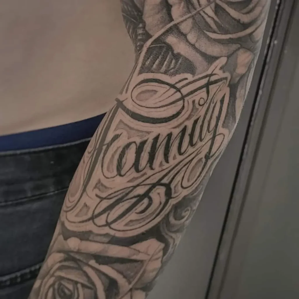 script family and roses lettering tattoo