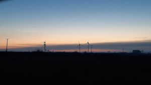 photo of windturbines at sunset