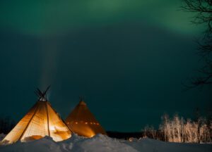 tiki tents under northern lights