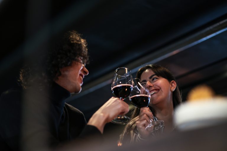 man and women cheers with wine. smalljpg