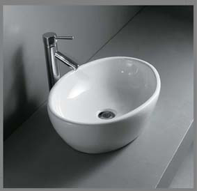 Model: 9006 Oval porcelænshåndvask til montering på bord. Uden overløb.  525x420x157