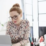 Woman in office using computer