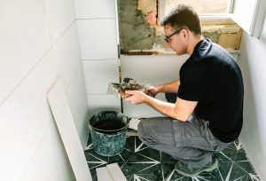 Mason working on a bathroom renovation