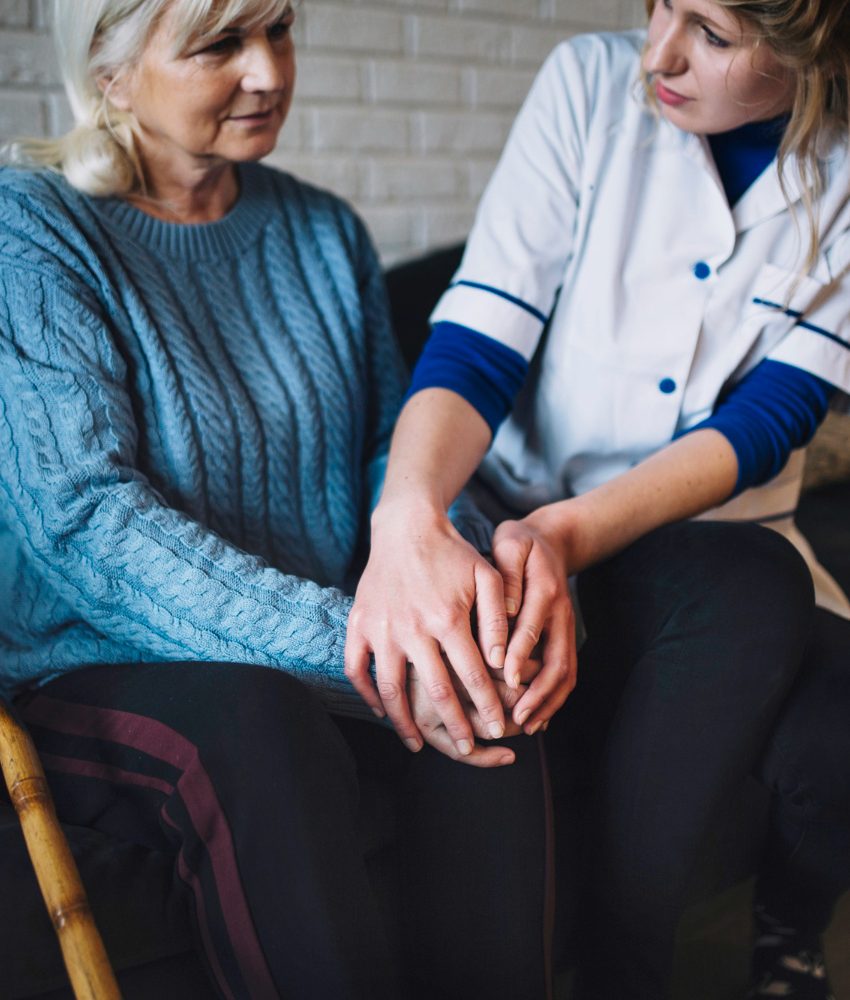 retirement-home-concept-with-nurse-taking-care-woman