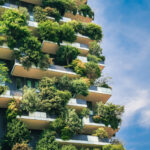 Green futuristic skyscraper Bosco Verticale, vertical forest apartment building with gardens on balconies. Modern sustainable architecture in Porta Nuova district, Milan, Italy.