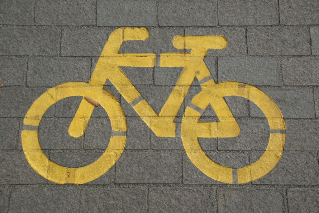 Cycle path marking on gray concrete