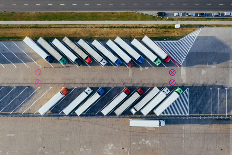 Aerial view of parked trucks; Marcin Jozwiak/Pexels