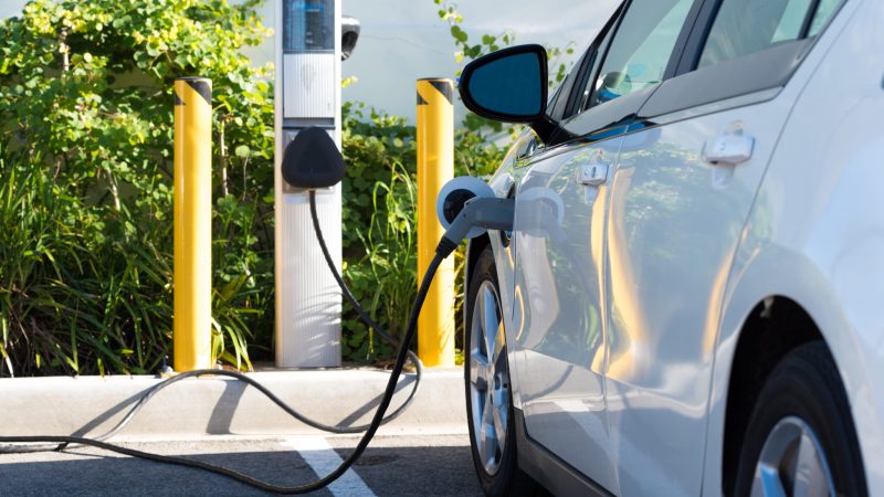 An electric car charging in California