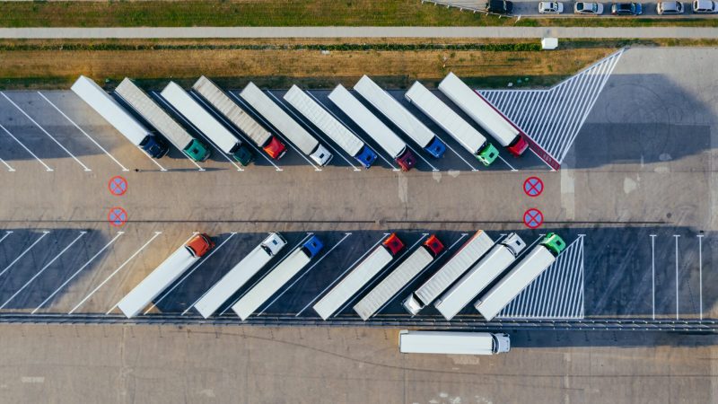 Aerial view of parked trucks; Marcin Jozwiak/Pexels