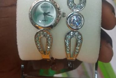 Trendy Ladies wristwatch and hand bracelet.