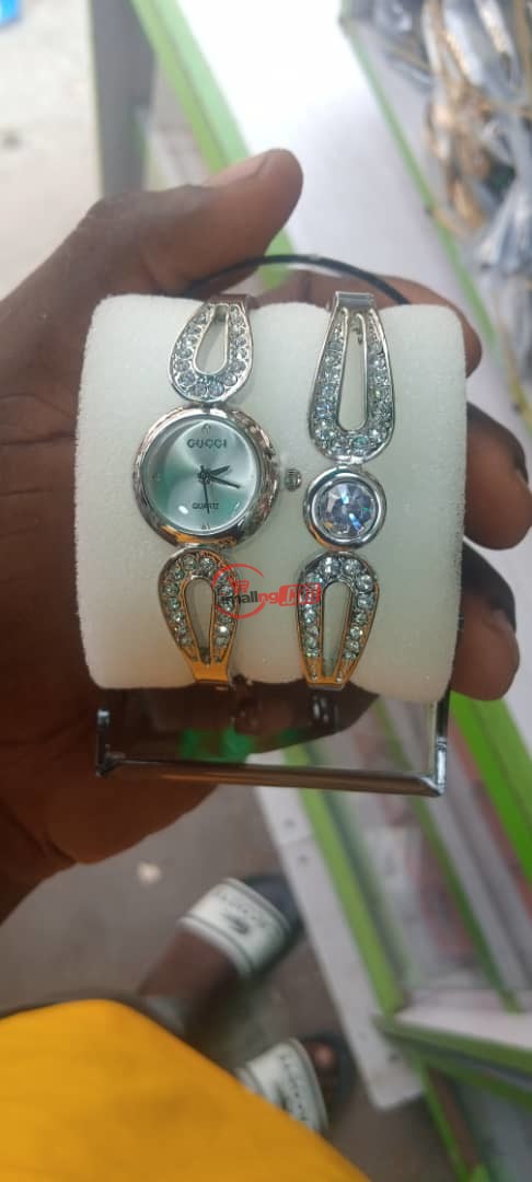 Trendy Ladies wristwatch and hand bracelet.