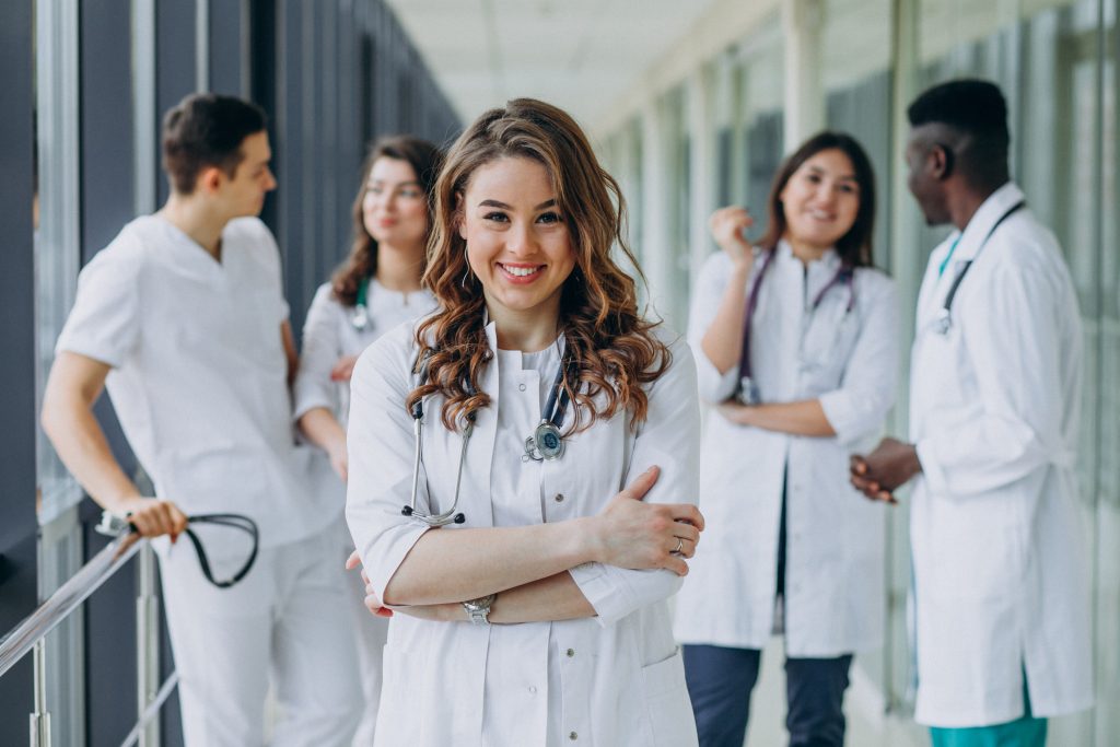 young-female-doctor-posing-corridor-hospital