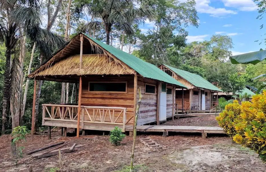 Remote eco lodge deep in the Amazon rainforest with wooden chalets