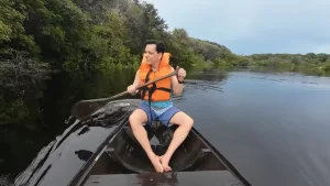 Guests canoeing in the Amazon rainforest - Watch A Journey Through the Amazon.
