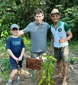 Guest planting a young tree at Tucan Amazon Lodge, Rio Negro region. This is about protecting and restoring