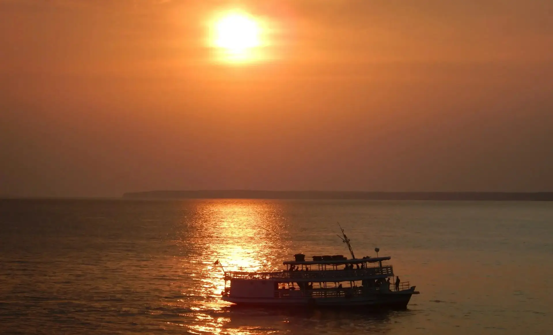Regional boat in Manaus Rio Negro sunset - Amazon River Cruise