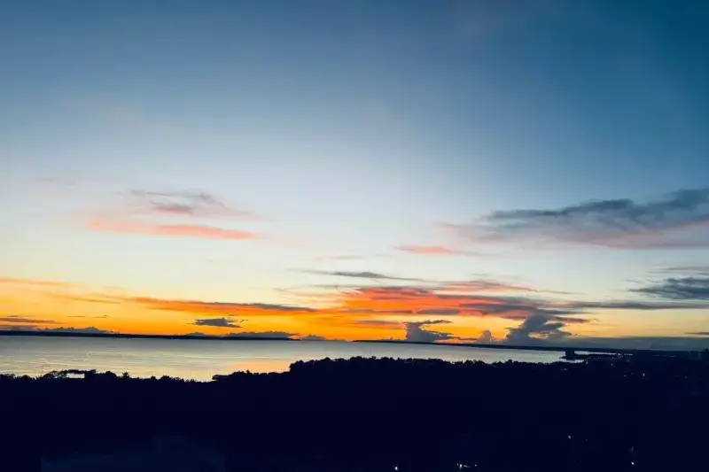 View over Rio Negro at sunset from Mara Sunset Amazon apartment balcony in Ponta Negra, Manaus