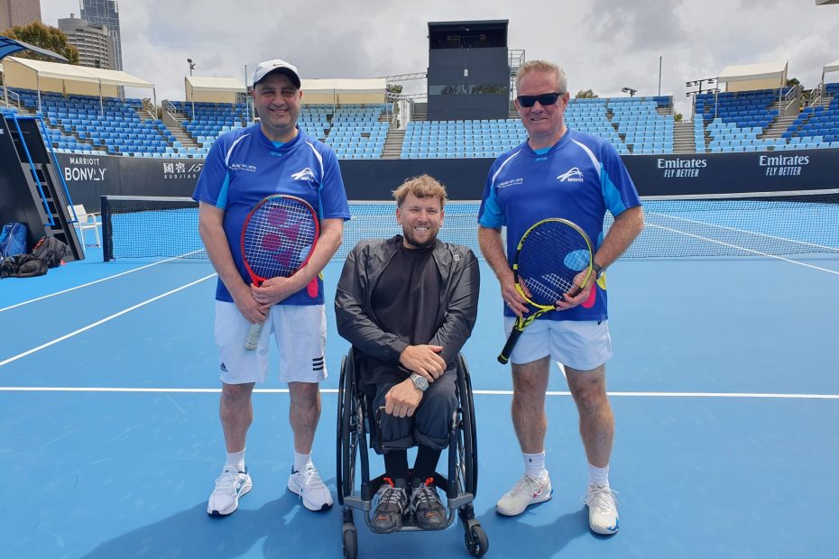 Photo of Australian blind and low visually impaired players Adam Fayad and Robert Fletcher with former world No.1 quad wheelchair player Dylan Alcott on a tennis court at Melbourne Park. Courtesy of Adam Fayad