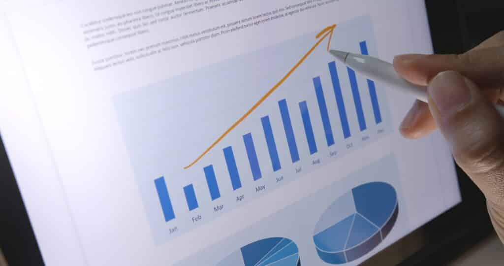 Close-up hand use pen write check growth data number