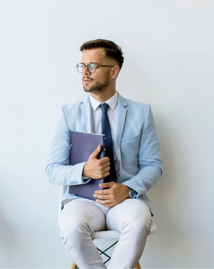 Image representing a job seeker: Depicts an individual waiting for a interview for employment opportunities, highlighting determination and ambition.