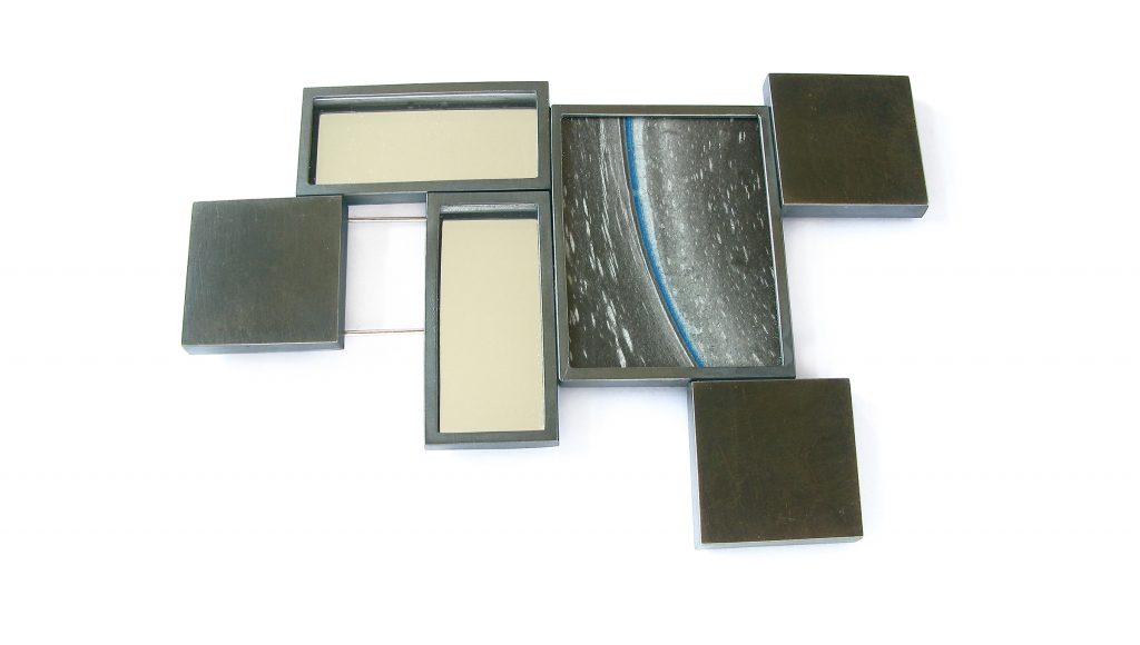 Georg Dobler. Brooch, Horizon, silver frame and surface, mounted , surface casted and patinated