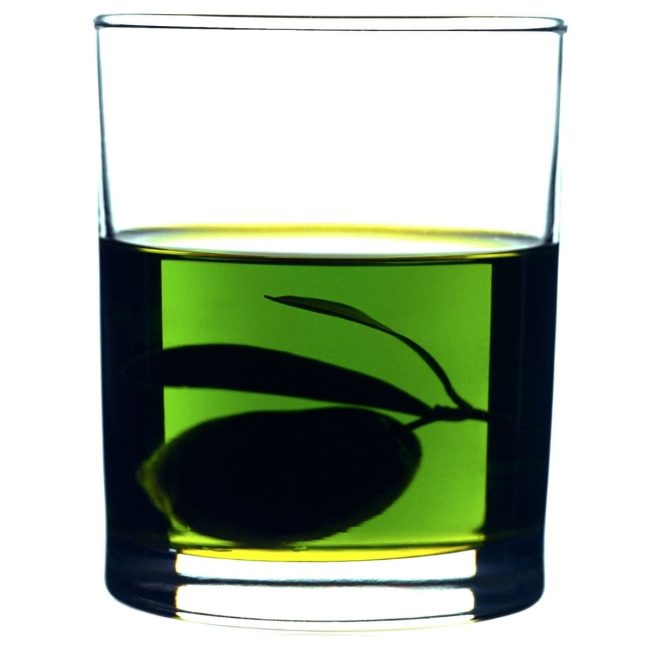 A GLASS OF GREEN EVO OIL FROM ITALY