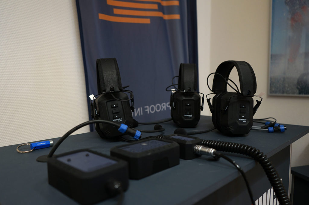 Three iriComm 3.0 headsets on a demostration table.