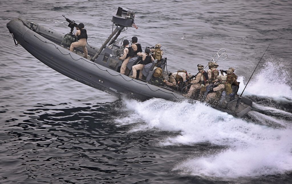 US marines on a high speed ocean vessel