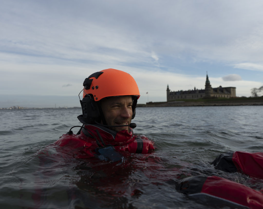 IWCS interns in the water off Kronborg castle in Helsingoer.