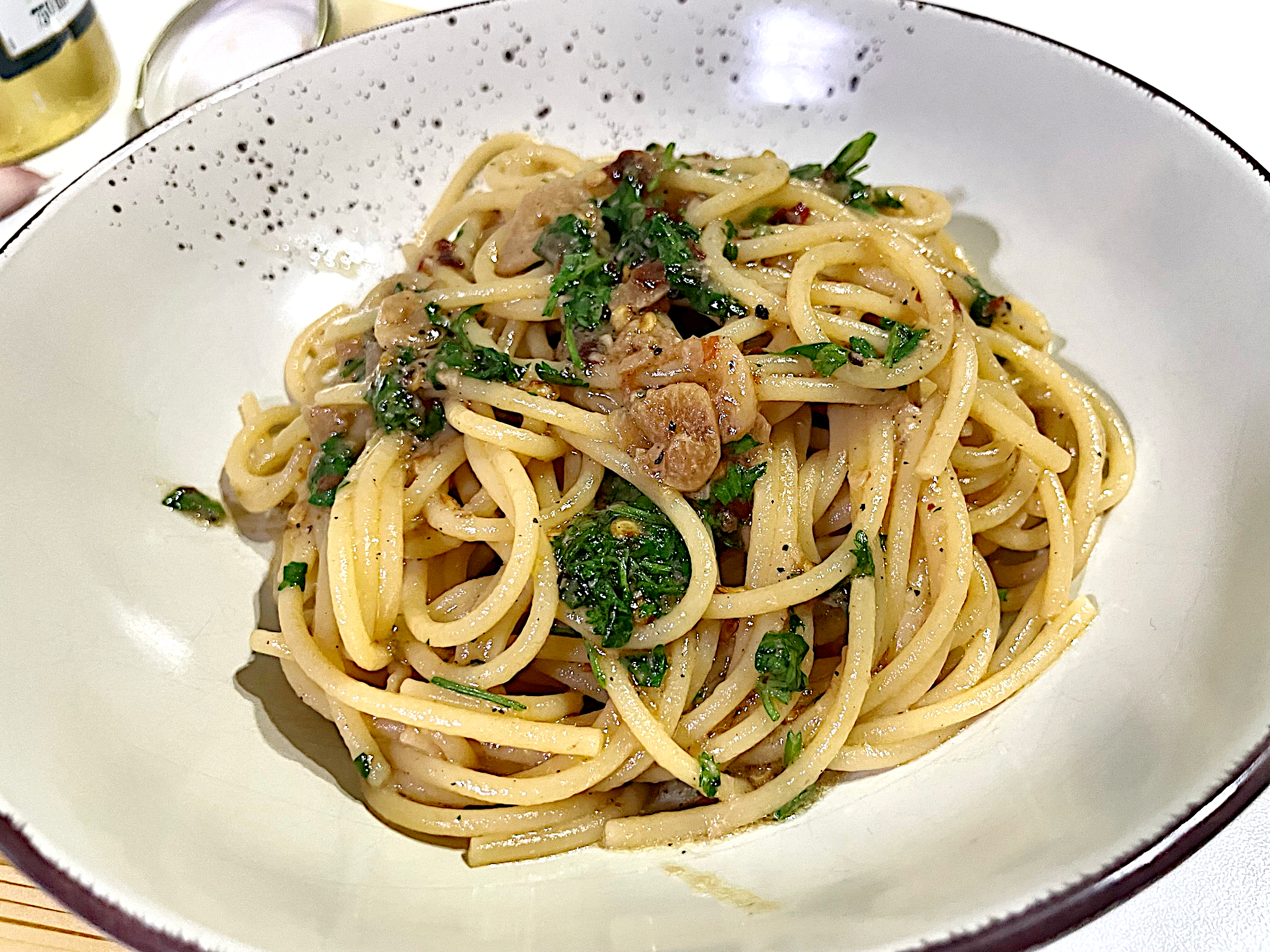 Spaghetti with homemade chilli oil, garlic and koriander in a bowl