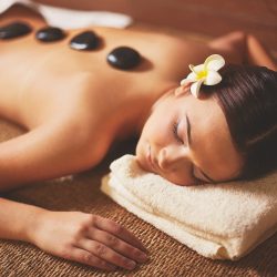 Portrait of young female lying in spa salon during beauty procedure