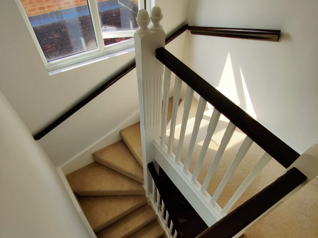 The finished result of a decorating project - including bannisters and walls.