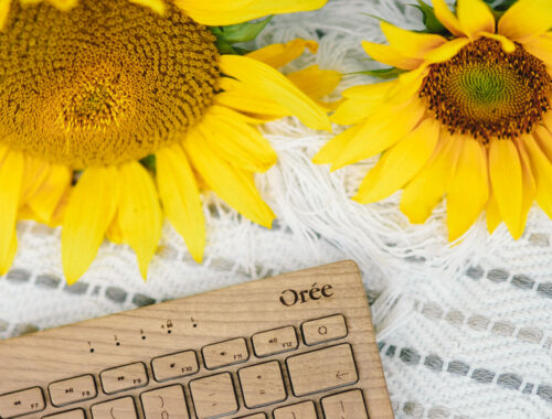 wooden keyboard with sunflowers