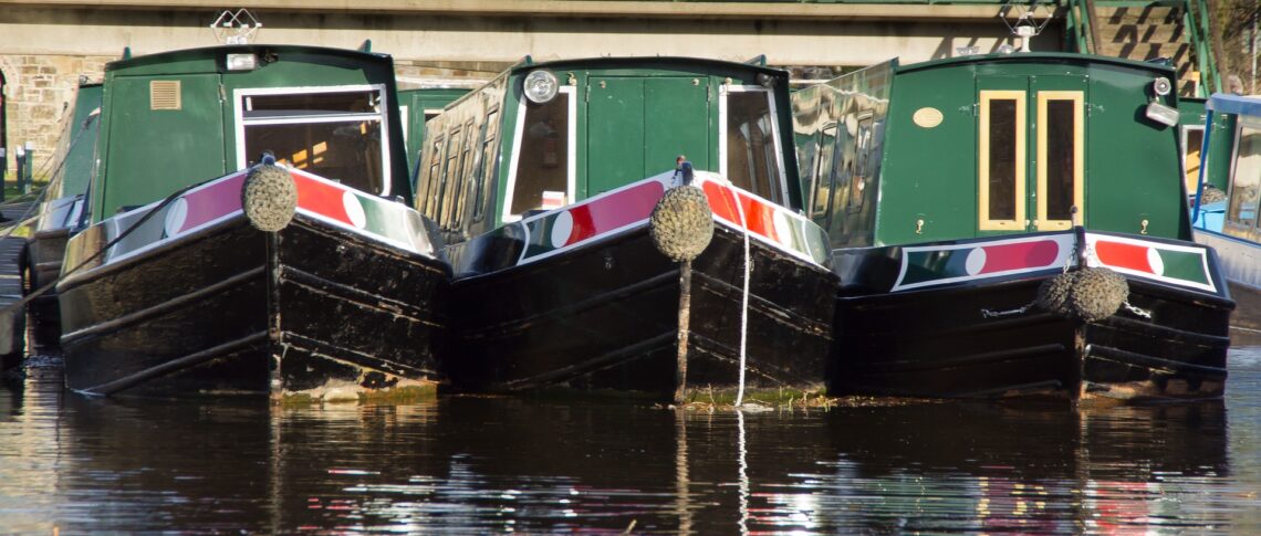 three similar boats next to one another