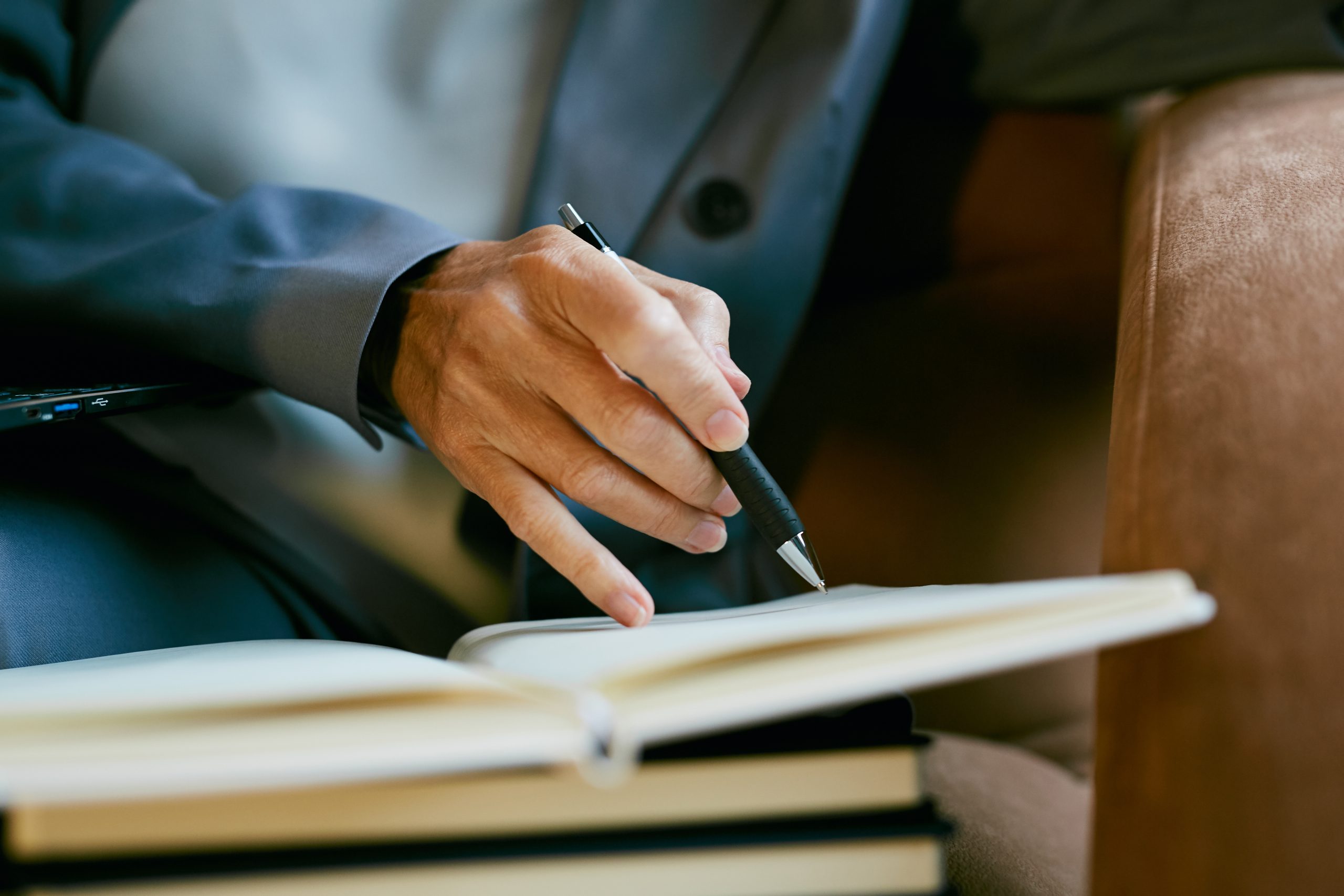 Businesswoman Writing in Planner Close up