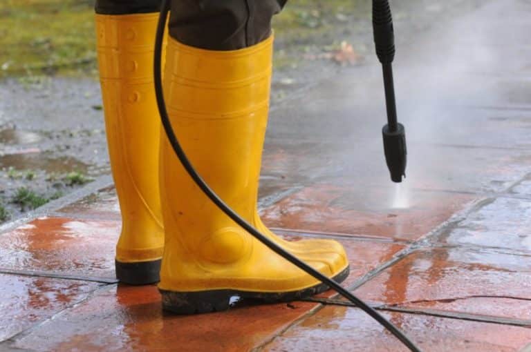 person-wearing-yellow-rubber-boots-with-high-pressure-water-nozzle-cleaning-dirt-tiles [800x600]